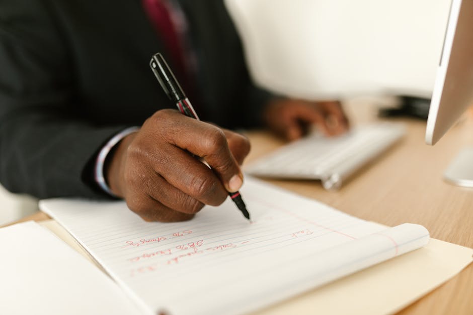 Business professional at computer with professional writing software and AI copywriting tools displayed